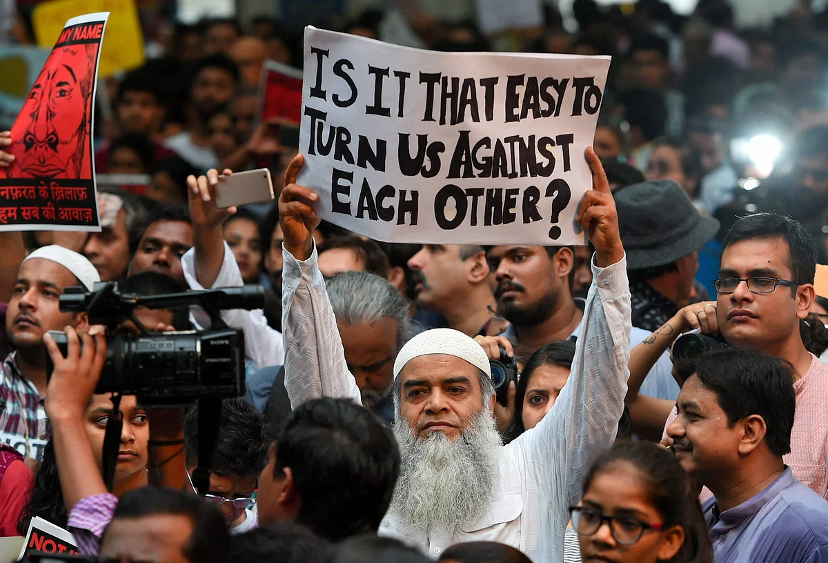 A protester asks, “Is it that easy to turn us against each other?” at the ‘Not in My Name’ protest in New Delhi.