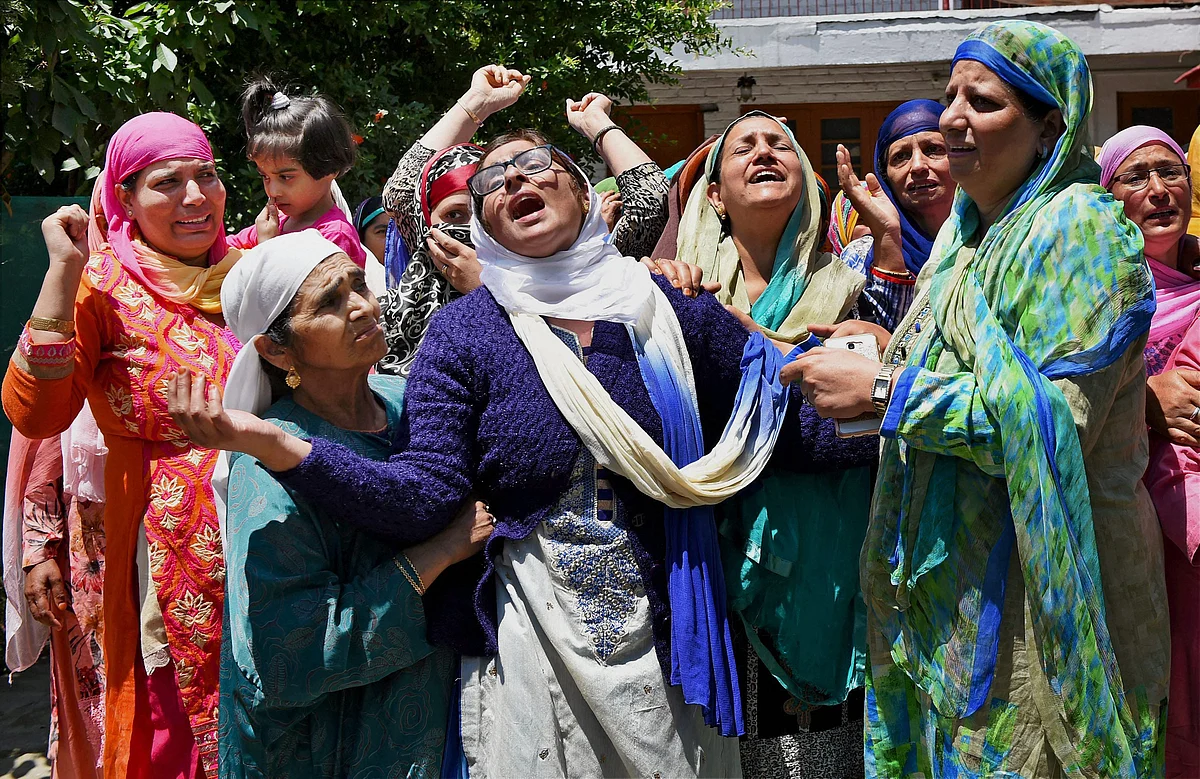 Family members and relatives mourn the death of Dy SP Mohammad Ayub Pandith at his residence in Srinagar on Friday. 