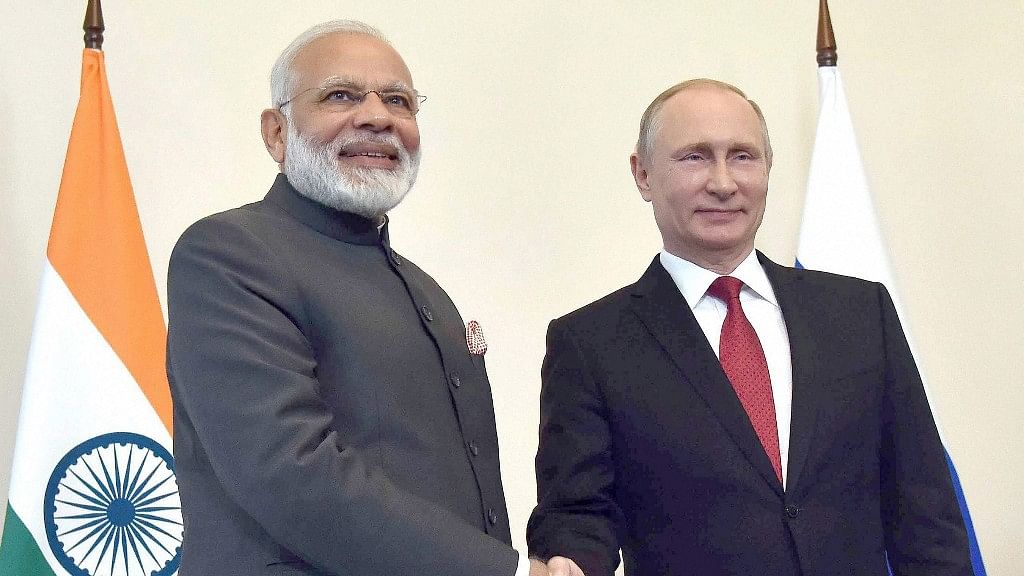 Prime Minister Narendra Modi shakes hands with Russian President Vladimir Putin, at the 18th India Russia Annual Summit (Photo: PTI)