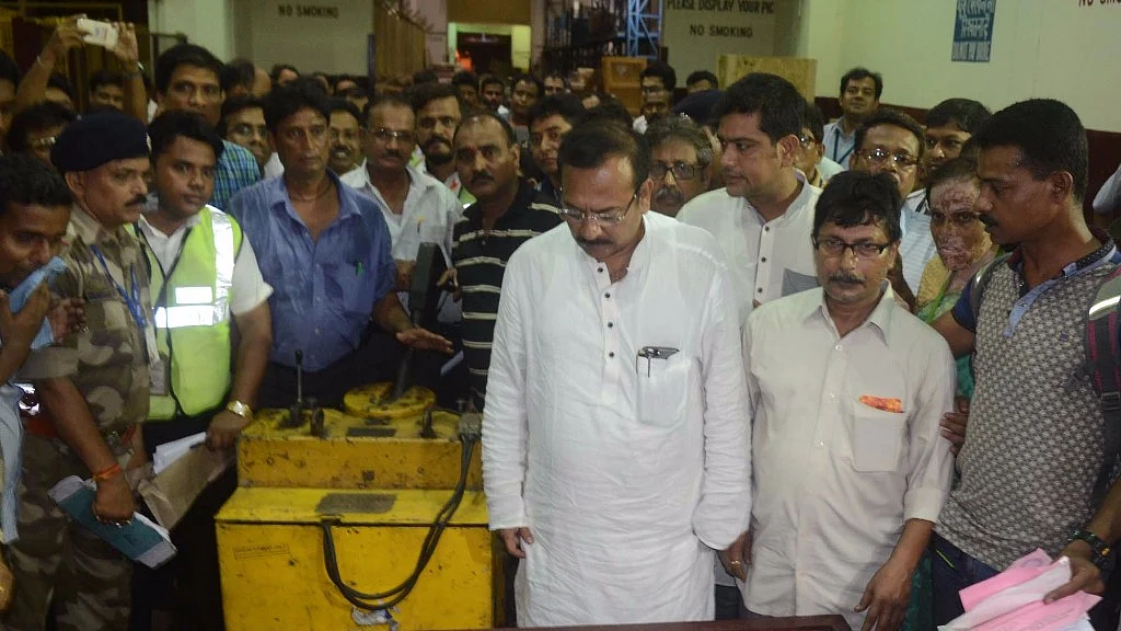 West Bengal Sports Minister Aroop Biswas receives the coffins of Paresh Chandra Nath and Gautam Ghosh who died on Everest last year, Kolkata airport, 1 June, 2017. (Photo: IANS)