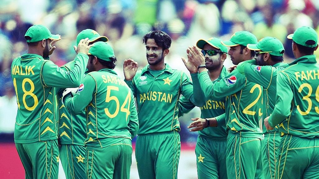 Pakistan’s Hasan Ali, centre, celebrates  a wicket with his team-mates during the  ICC Champions Trophy. (Photo: AP)
