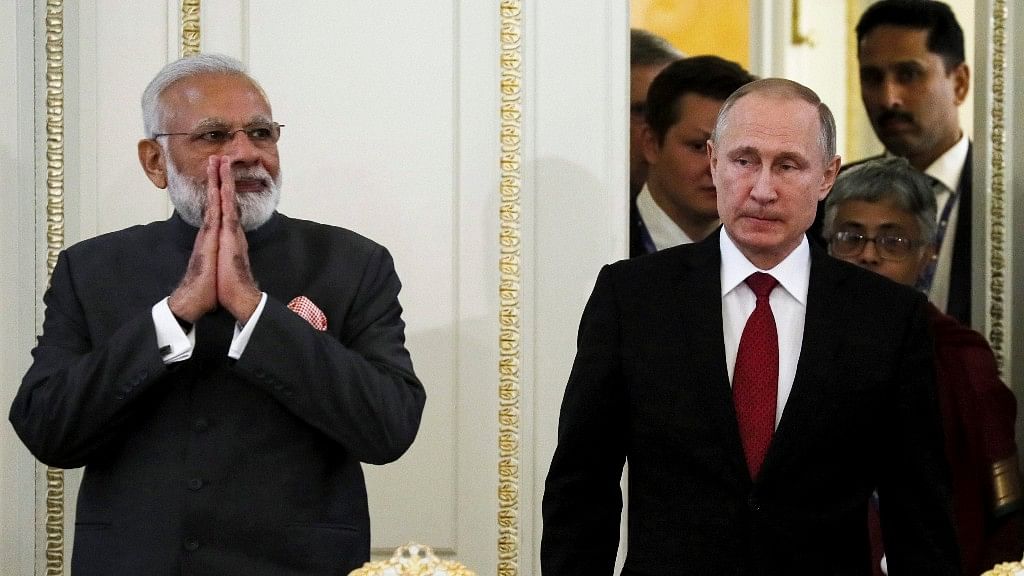 Prime Minister Narendra Modi (left) and Russian President Vladimir Putin arrive to attend a meeting with businessmen at the St Petersburg International Economic Forum. (Photo: PTI)