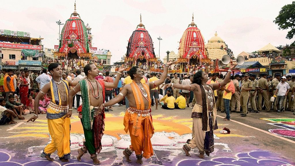 

Odissi dancers perform in front of the three chariots during the inauguration of the annual Lord Jagannath Rathyatra festival in Puri.