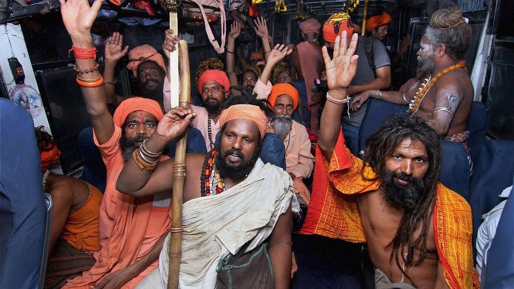 Sadhus chant religious slogans during their Amarnath Yatra in Jammu on Wednesday.&nbsp;