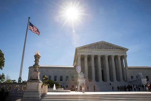 People visit the Supreme Court as justices issued their final rulings for the term, in Washington on 26 June 2017.