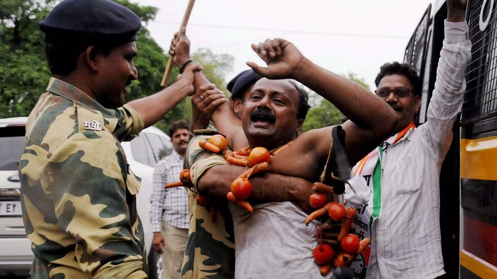 Police detain NCP farmers during a protest as part of their Maharashtra bandh over various demands, in Nagpur on Monday. (Photo: PTI)