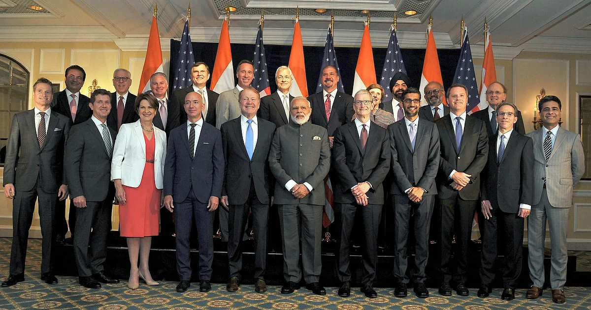Prime Minister Narendra Modi pose for a group photograph with US business leaders at a meeting in Washington DC on Sunday. (Photo: PTI)
