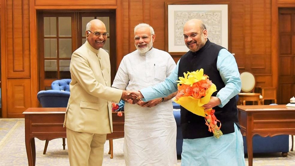 PM Modi, Amit Shah, and Bihar Governor Ram Nath Kovind. (Photo Courtesy: Twitter/<a href="https://twitter.com/narendramodi/status/876822938833502209">@narendramodi</a>)