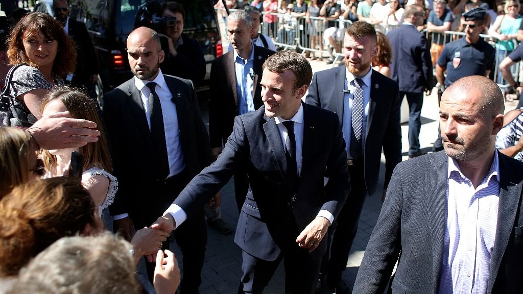 France’s President Emmanuel Macron meets people as he arrives at his house in Le Touquet, eastern France on Saturday. (Photo: AP)