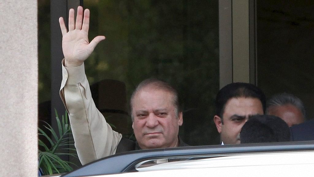 Pakistani Prime Minister Nawaz Sharif waves as he appears outside the premises of Joint Investigation Team in Islamabad, Pakistan. (Photo: PTI)