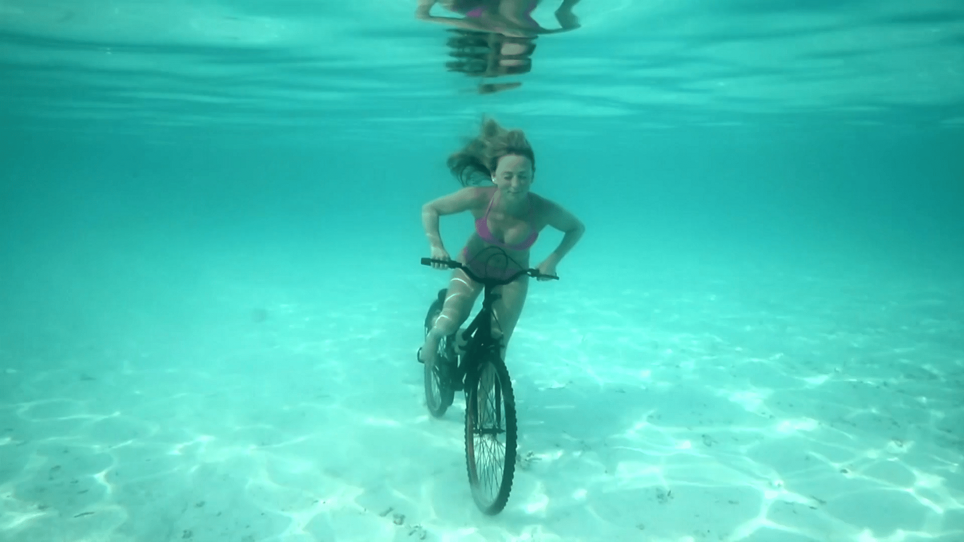 Activist cycles underwater to spread awareness about climate change. (Photo: AP screengrab)