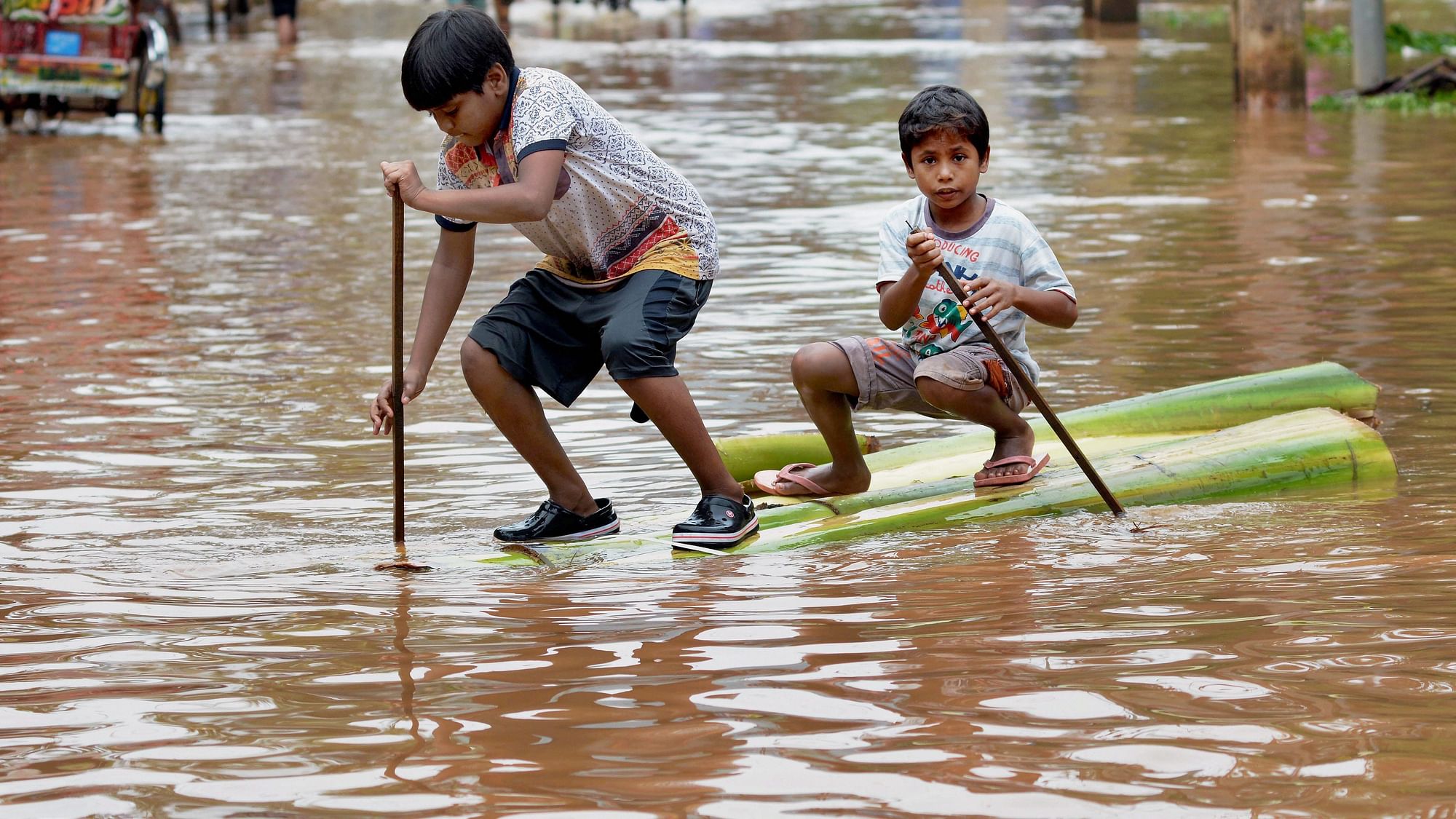 Image of two boys wading a flood street in Guwahati used for representation purpose.
