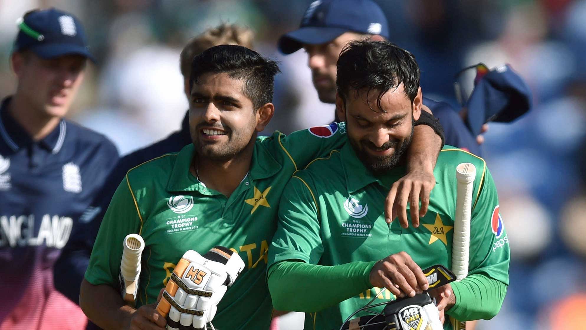 Pakistan’s Babar Azam and Mohammad Hafeez celebrate victory after the ICC Champions Trophy, semi-final match at the Cardiff Wales Stadium. (Photo: AP)