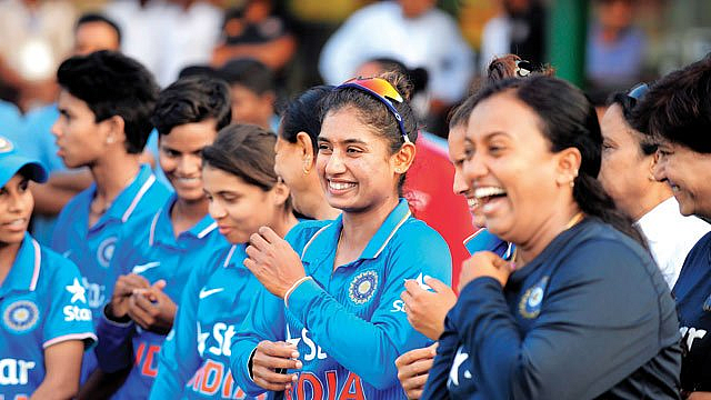 Mithali Raj sharing a light moment with her teammates.