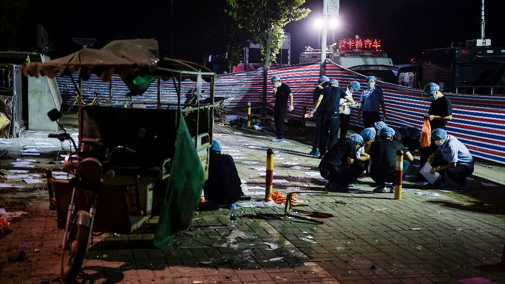 In this photo released by China’s Xinhua News Agency, investigators work early Friday morning at the scene of an explosion outside a kindergarten in Fengxian County in eastern China’s Jiangsu Province. (Photo: AP)