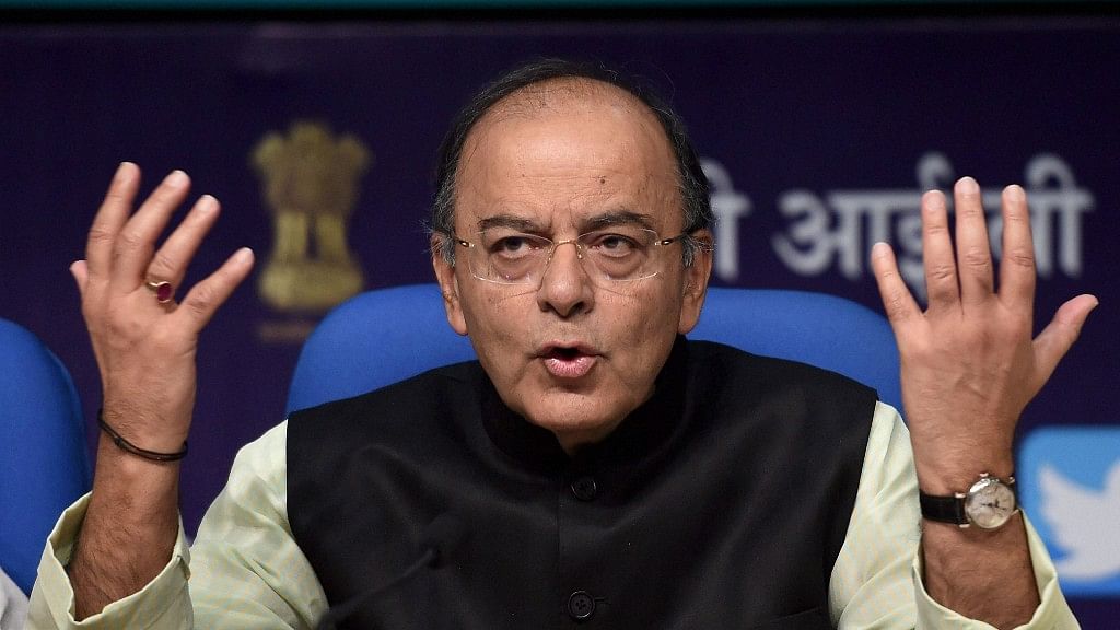  Union Minister for Finance, Defence and Corporate Affairs, Arun Jaitley addresses a press conference on three years achievements of NDA-led government at the Centre, in New Delhi on Thursday. (Photo: PTI)
