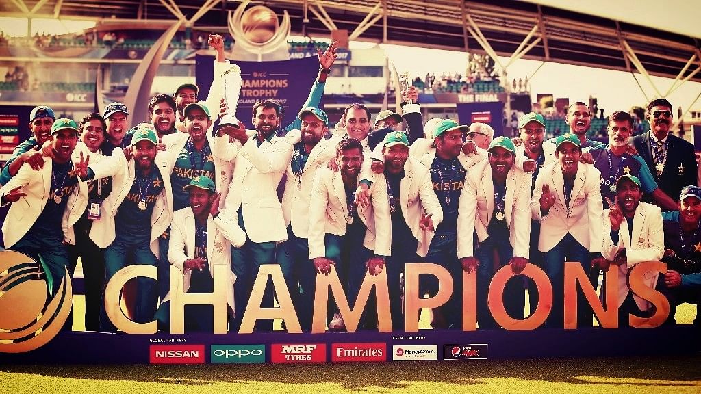The Pakistan team pose with the ICC Champions Trophy after beating India in the final on Sunday. (Photo: Reuters)