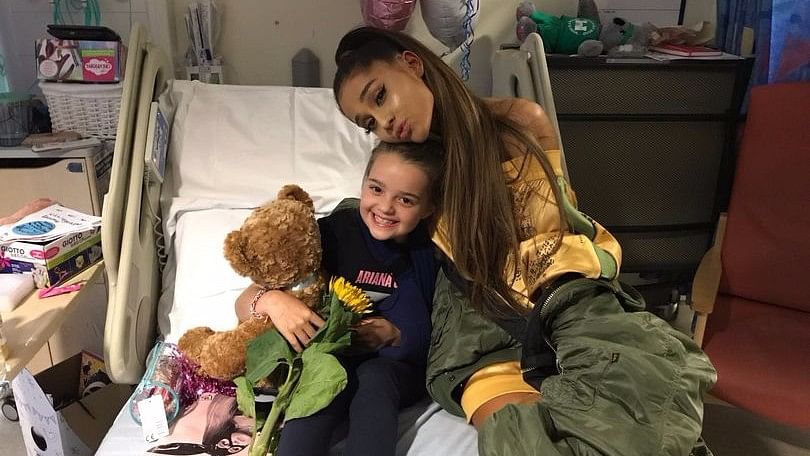 Ariana Grande with a young fan. (Photo courtesy: Twitter)