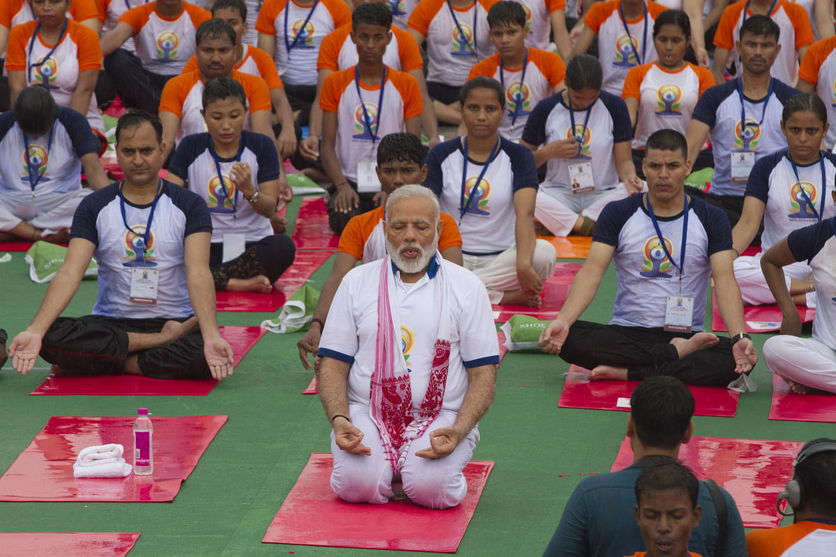 In Pics: People Pause, Stretch and Pose for International Yoga Day