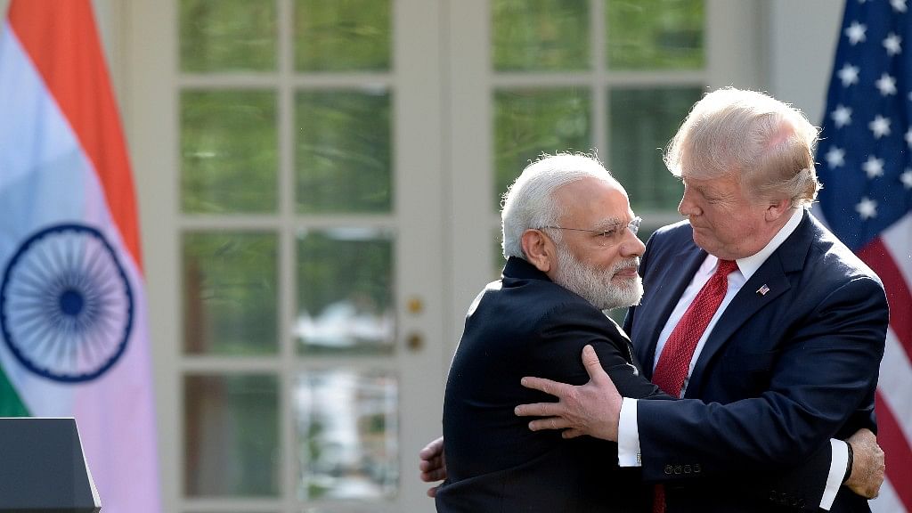 President Donald Trump and Prime Minister Narendra Modi hug while making statements in the Rose Garden of the White House in Washington.