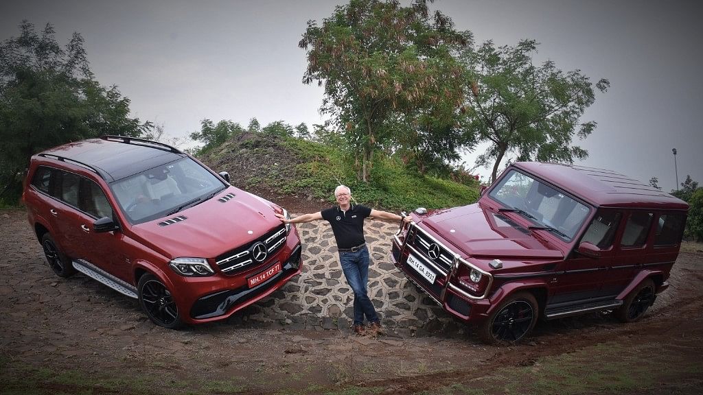 Roland Folger, Managing Director &amp; CEO, Mercedes-Benz India, with the AMG GLS63 (left) and the AMG G63 SUVs. (Photo: Mercedes-Benz India)