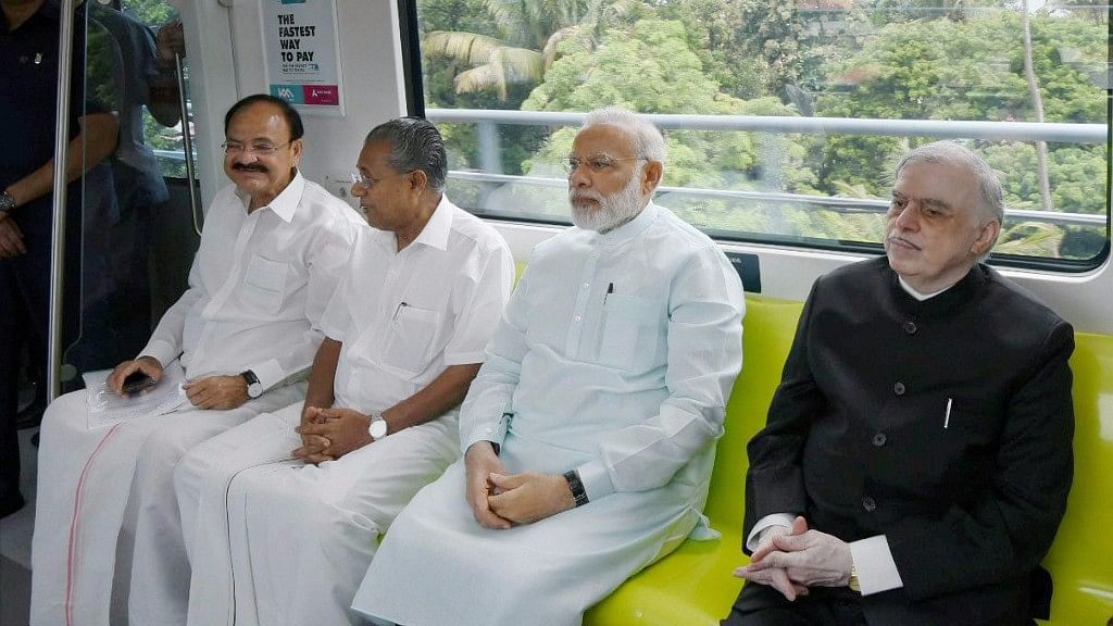 

 Prime Minister Narendra Modi, Kerala Governor P Sathasivam, CM Pinarayi Vijayan and Union Minister Venkaiah Naidu take a ride in the newly launched Kochi Metro in Kerala on Saturday. (Photo: PTI)