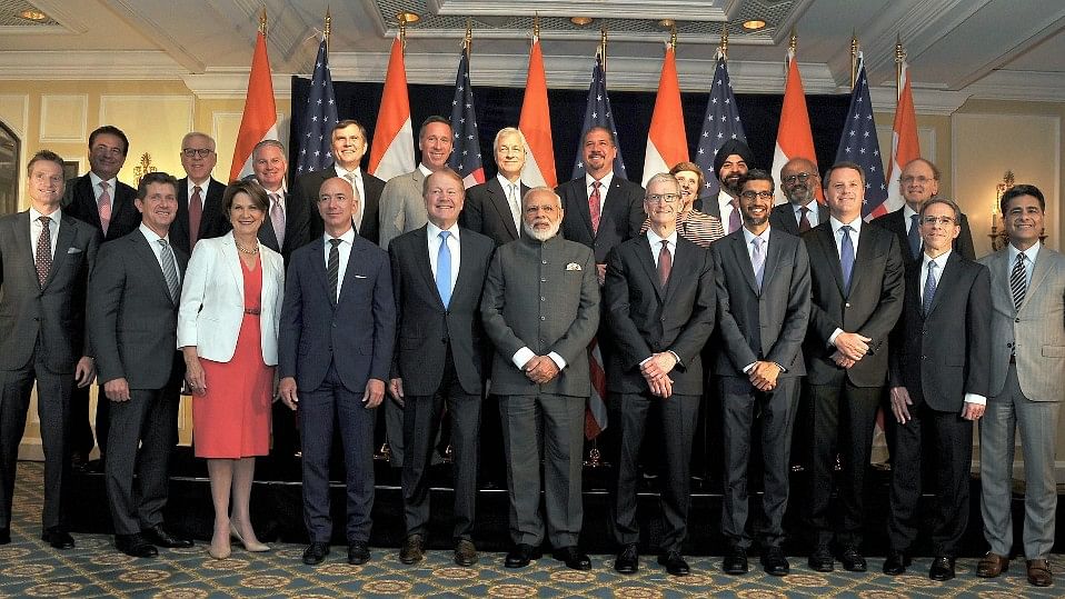 Prime Minister Narendra Modi poses for a group photograph with US business leaders at a meeting in Washington DC, USA on Sunday.&nbsp;