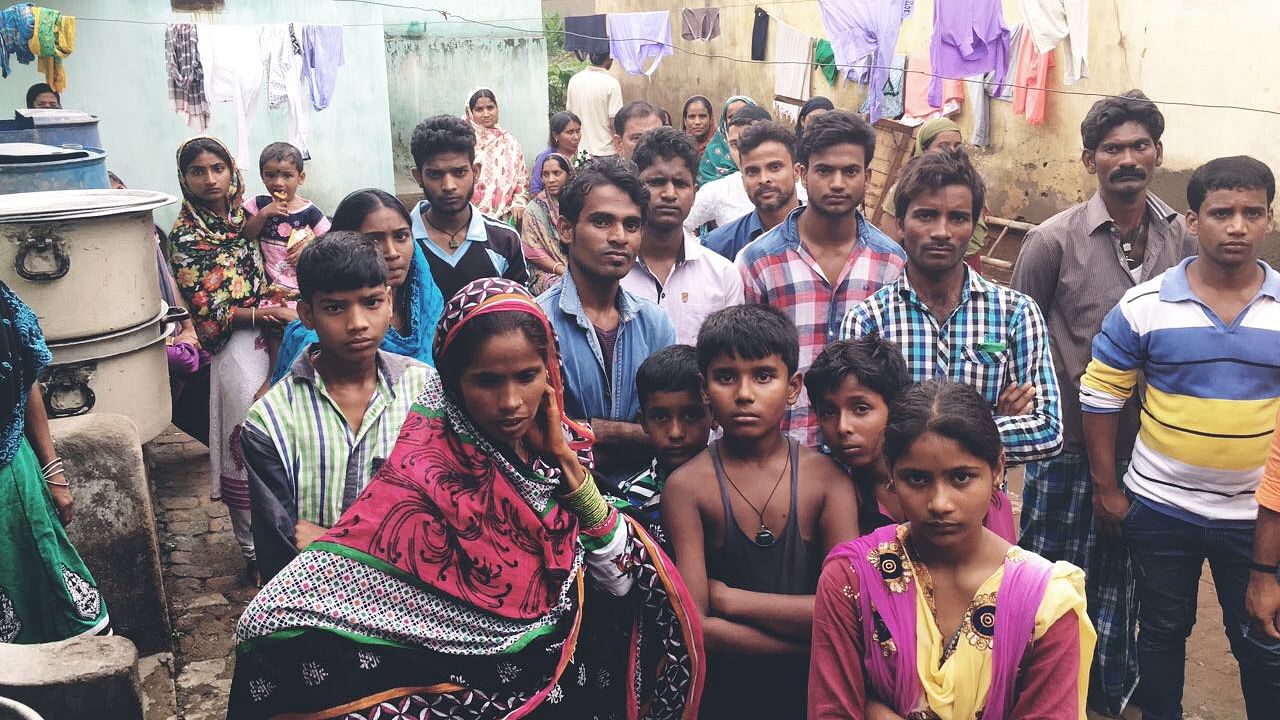 Villagers gather outside Ansari’s house in Ramnagar district in Jharkhand. It took two attempts by the police to get the Ansari’s family to take the body back. (Photo: Aishwarya S Iyer/<b>The Quint</b>)