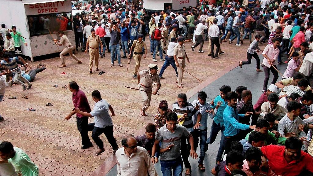 Police lathi charge textile traders who were staging a protest against GST in Surat on Monday. (Photo: PTI)