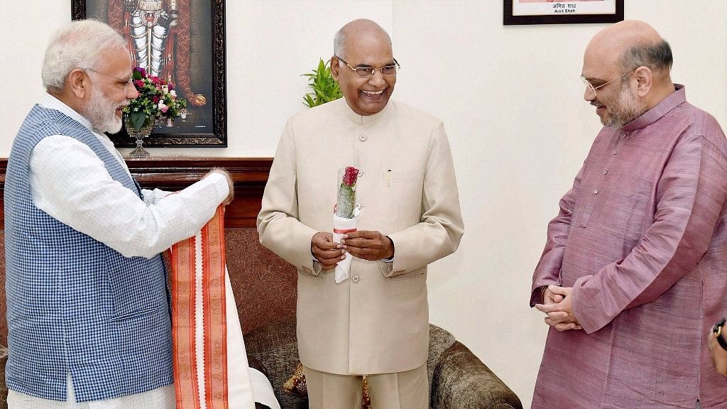 Prime Minister Narendra Modi and BJP President Amit Shah greet Ram Nath Kovind on being elected as the 14th President of India, in New Delhi on Thursday.