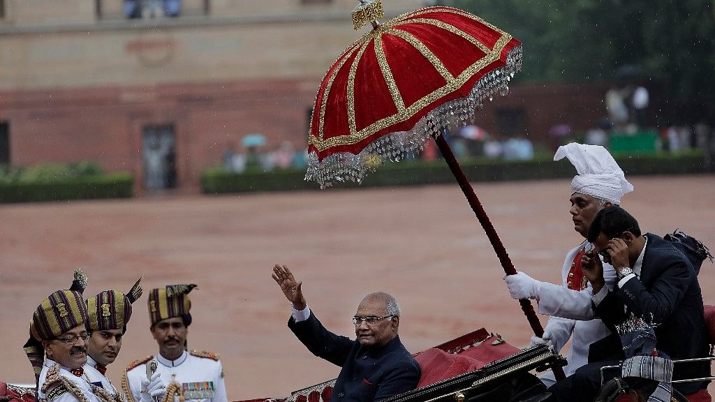 India’s new President Ram Nath Kovind, waves as he arrives in a traditional horse driven carriage at the Presidential Palace after being sworn in.