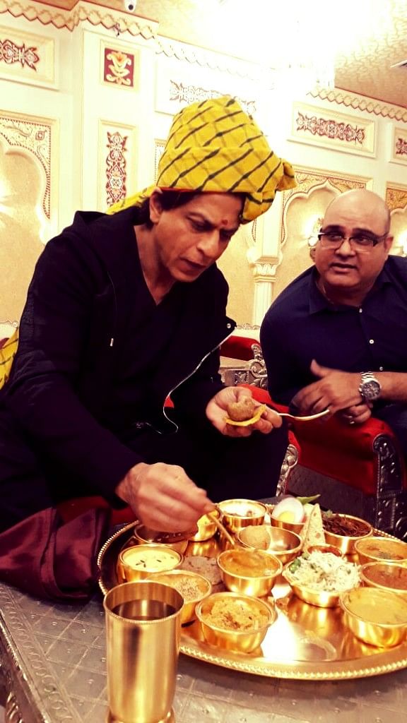 

Shah Rukh Khan tastes dal baati churma for the first time.