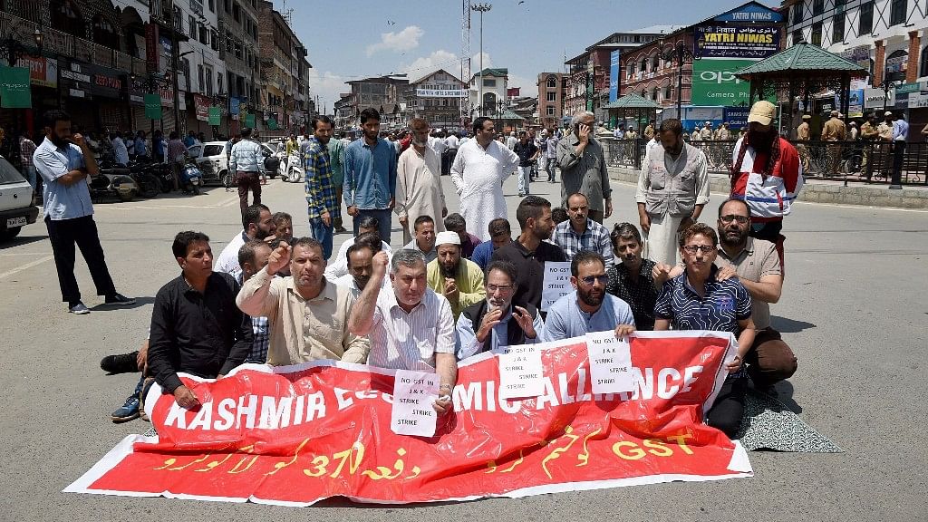 Protesters in Srinagar demand exclusion from for Jammu and Kashmir for GST.&nbsp;