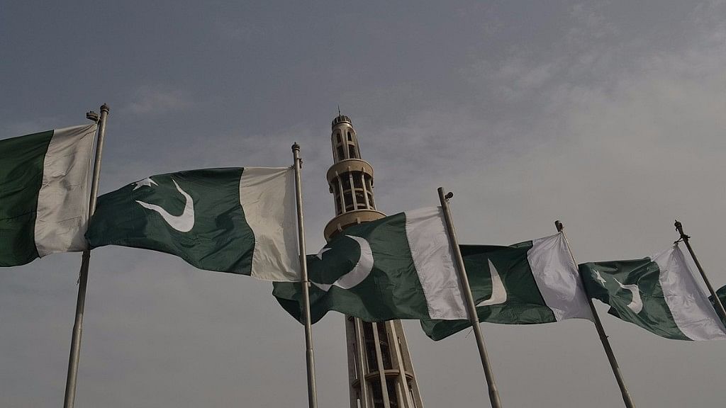 View of the Pakistani national flag fluttering in front of the Minar-e-Pakistan.&nbsp;