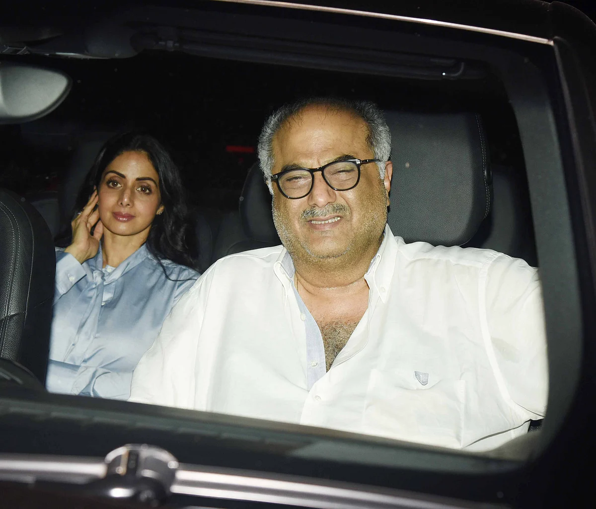 Sridevi takes the back seat with Boney Kapoor in front.