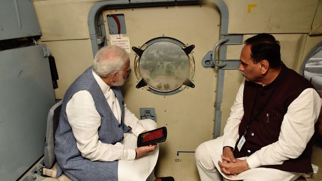 Modi conducts an aerial survey over the flood-ravaged zones in Gujarat.