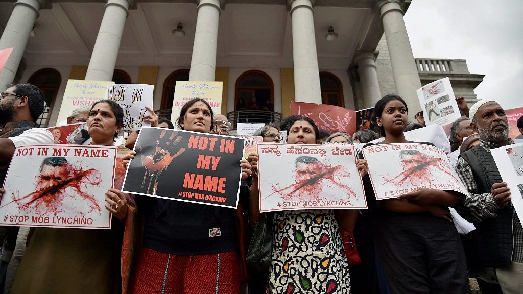 

 Citizens hold placards during a silent protest “ Not in My Name “ against the targeted lynching, in Bengaluru.&nbsp;