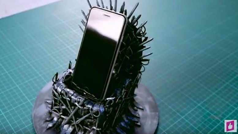 An iron throne phone stand.