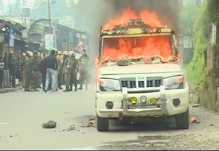 A police vehicle set ablaze by pro-Gorkhaland supporters. 