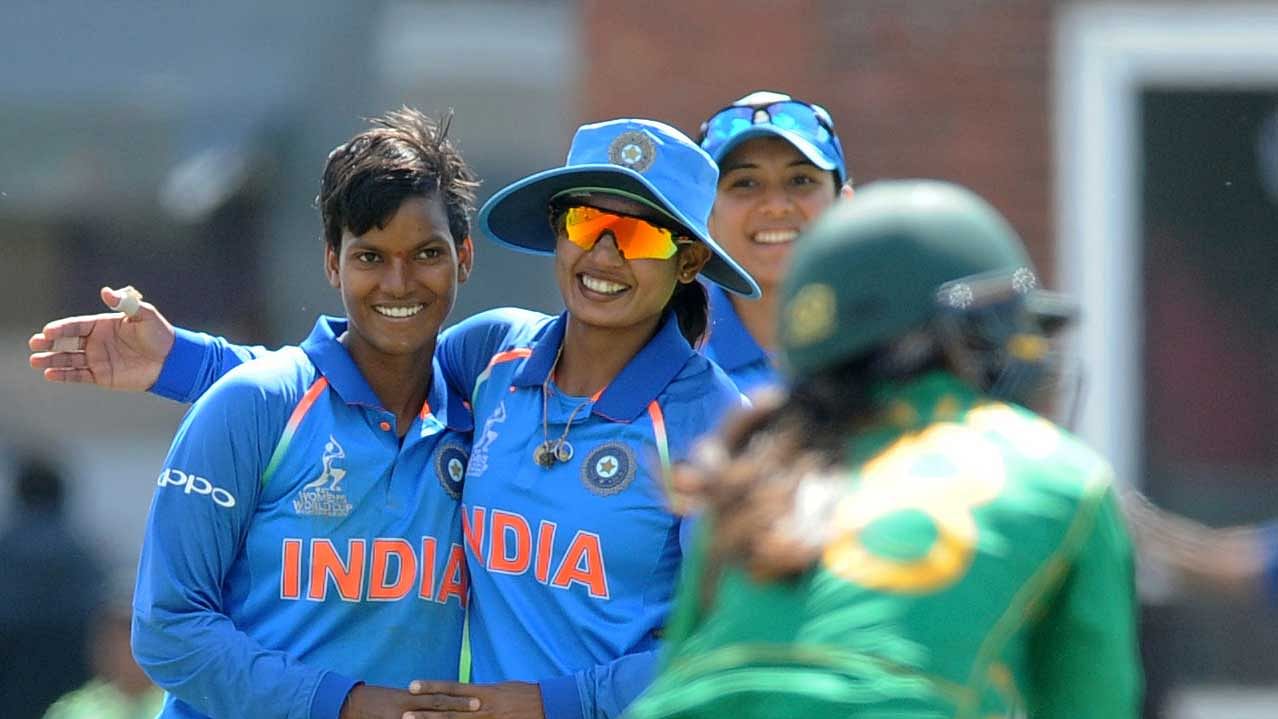 Indian cricketers congratulate teammate Deepti Sharma, left, for the dismissal of Pakistan’s Nain Abidi during the ICC Women’s World Cup 2017