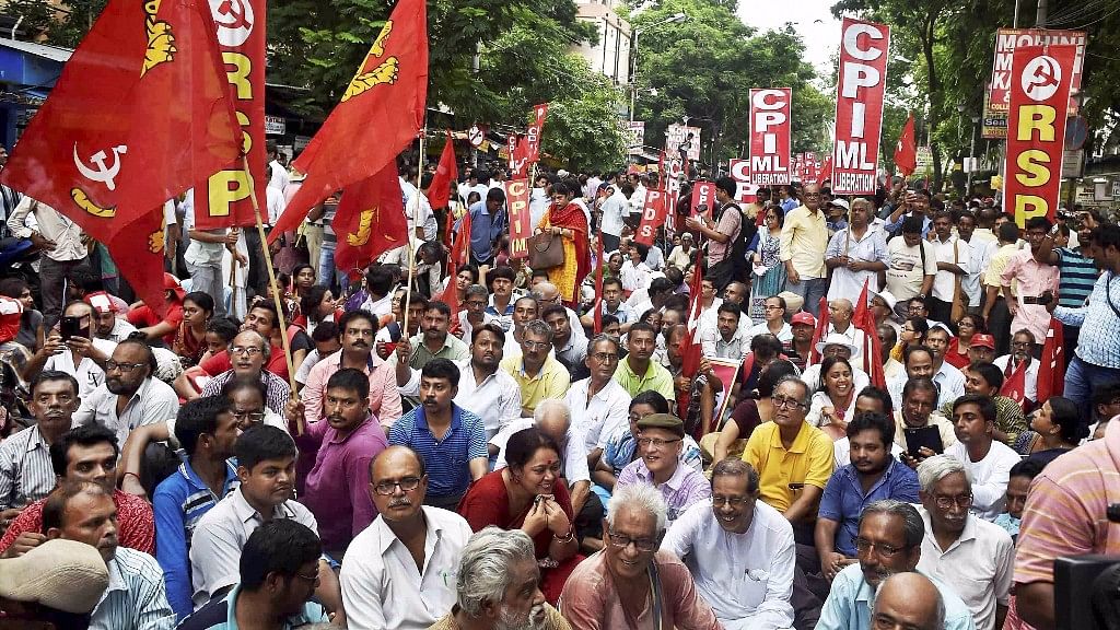 Left activists take part in a rally to protest against state government in front of Calcutta University in Kolkata on Tuesday.&nbsp;