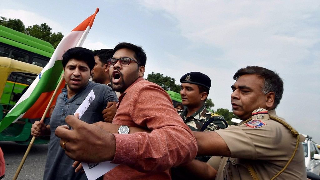 

Police detain NGO activists who were holding a silent protest march against the recent attack on Amarnath pilgrims, near Vijay Chowk in New Delhi on 12 July.