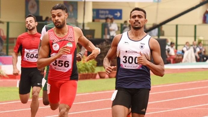 Mohammad Anas (R) in action during the heats of the 400m event.