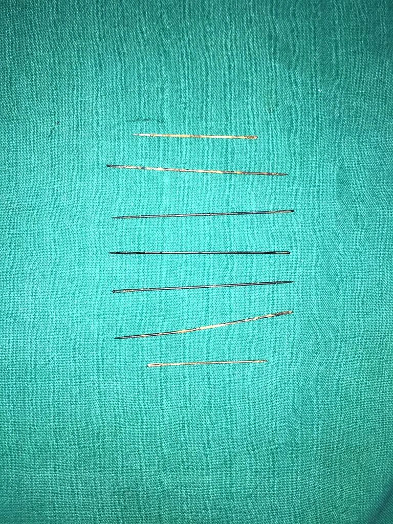 The needles removed from the body of the three-year-old.