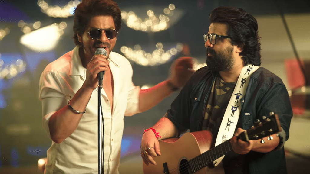 Shah Rukh Khan and music director Pritam in a still from the song <i>Safar</i>.