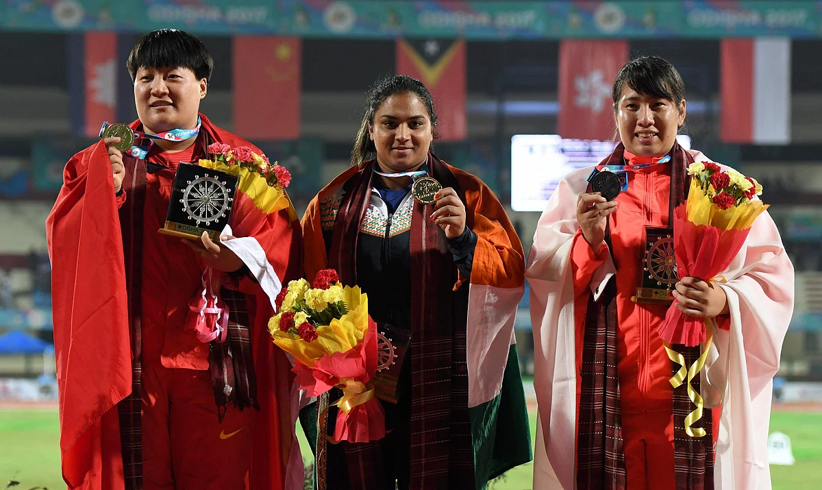 Manpreet Kaur flanked by Chinese athletes Guo Tianqian (Silver) and Aya Ota (Bronze) during the presentation ceremony of the Women’s Shot Put event during the 22nd Asian Athletics Championships in Bhubaneshwar