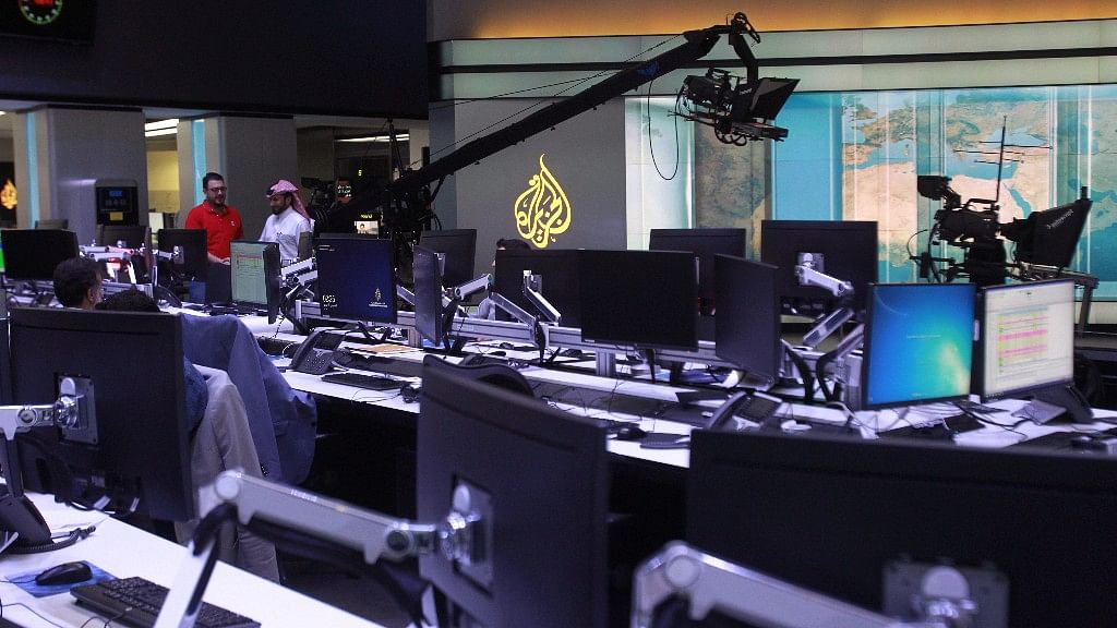 Staff work inside the headquarters of Al Jazeera Media Network, in Doha, Qatar. (Photo: Reuters)