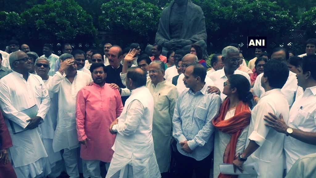 Opposition leaders protest the suspension of six Congress MPs. (Photo: ANI)