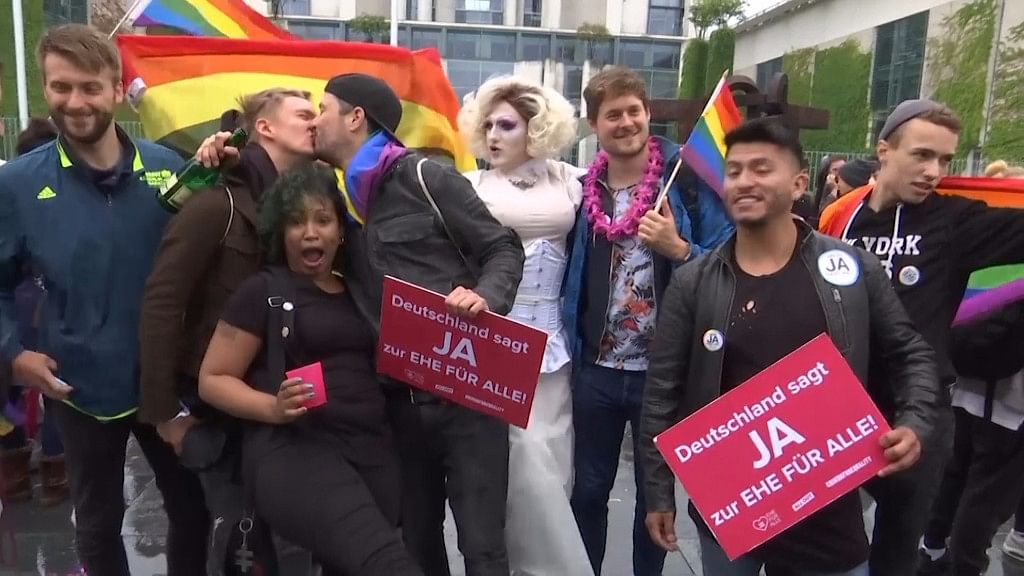 LGBTQ members and activists celebrate the legalisation of same-sex marriage.