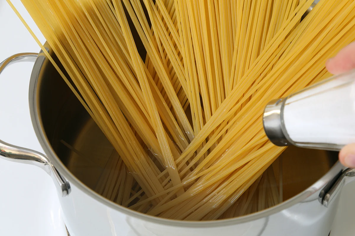 Mixing salt to pasta water helps season both the pasta and the water.